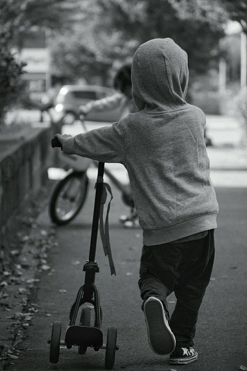 Boy with tricycle