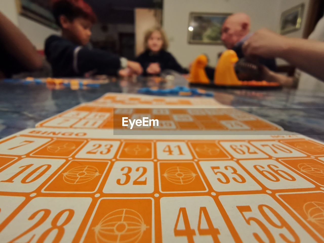 group of people, leisure games, men, indoors, leisure activity, adult, relaxation, table, sports, game, women, focus on foreground, number, opportunity, arts culture and entertainment, sitting, gambling, childhood, headshot