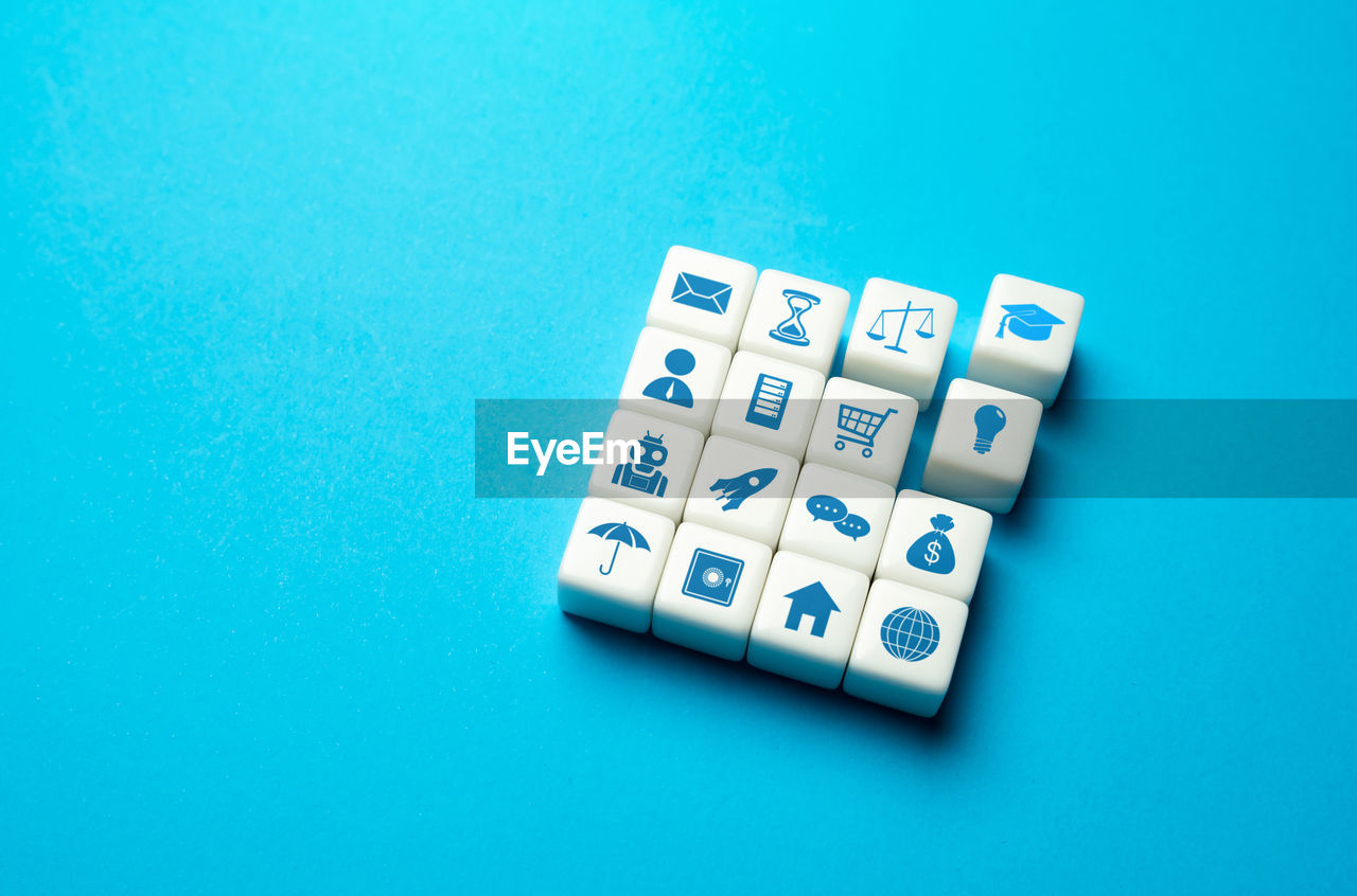 high angle view of dices on blue background