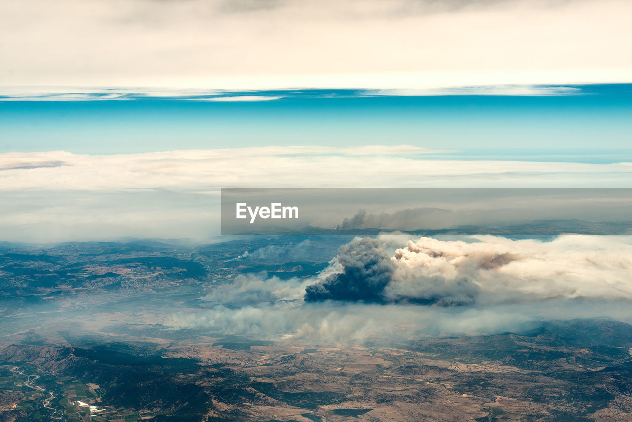 Aerial view of a big column of smoke from forest fire in southern chile