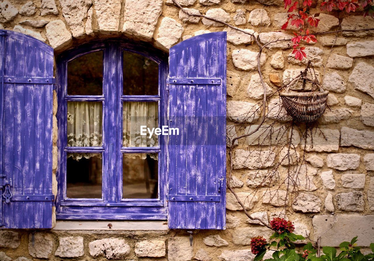 Open purple window of house