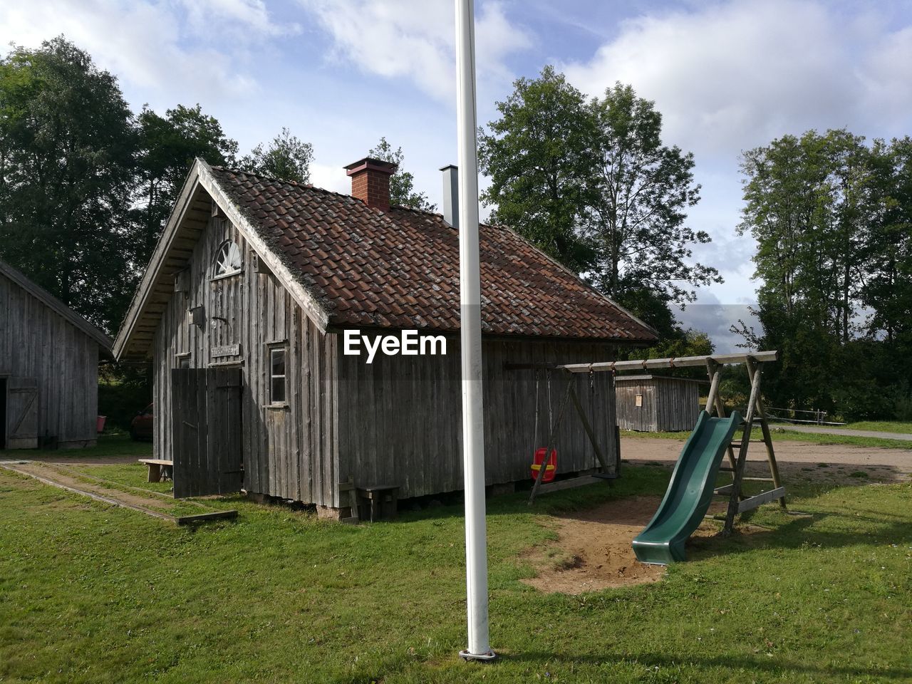 BUILT STRUCTURE ON FIELD AGAINST SKY