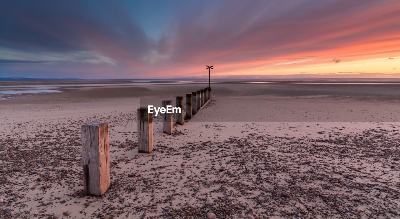 Scenic view of calm sea at sunset