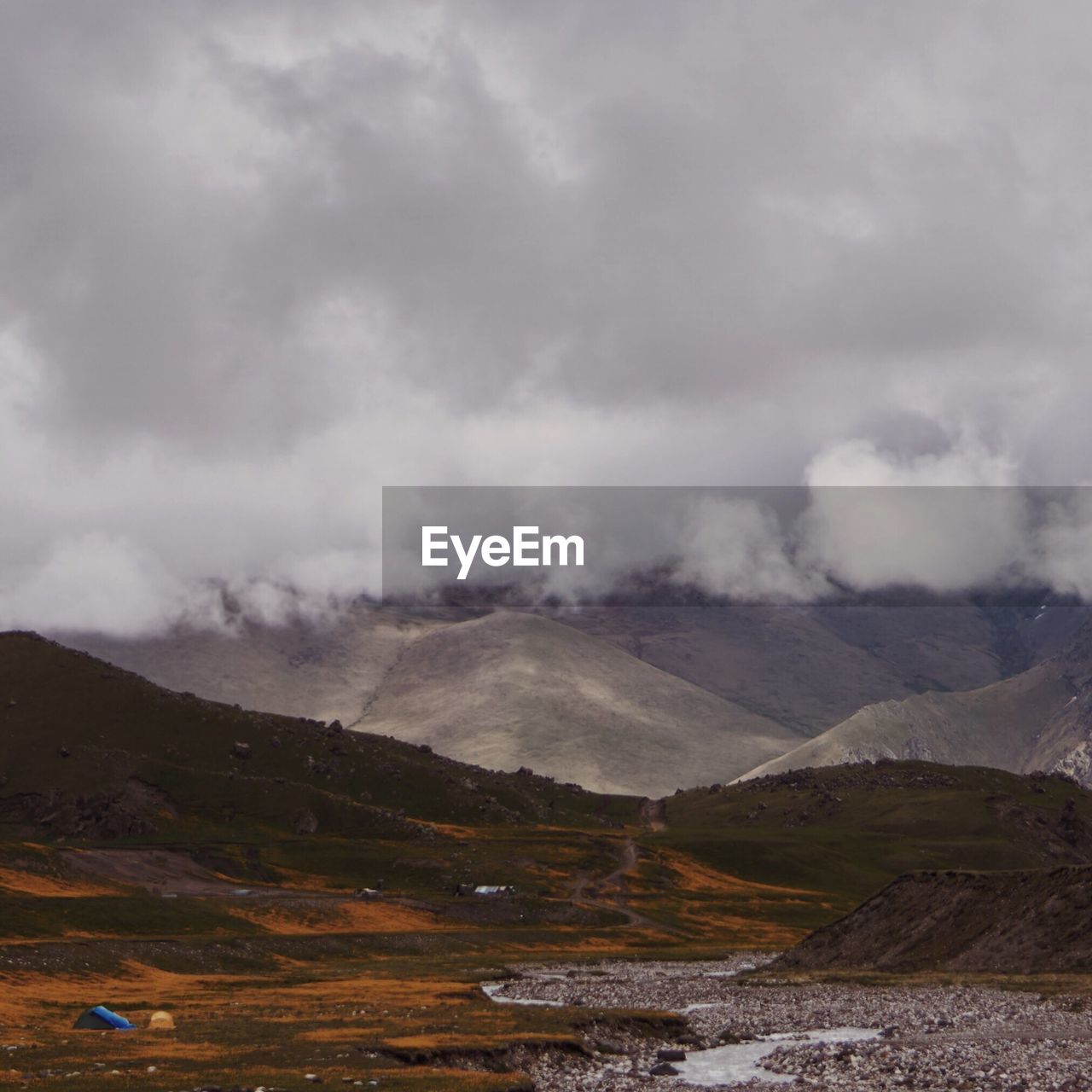 View of mountain range against cloudy sky