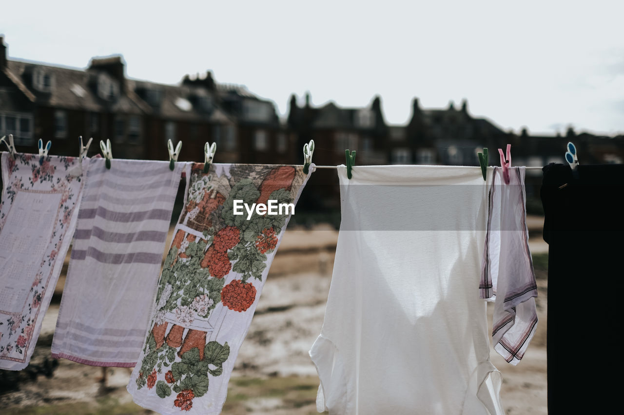 Clothes drying on clothesline against sky