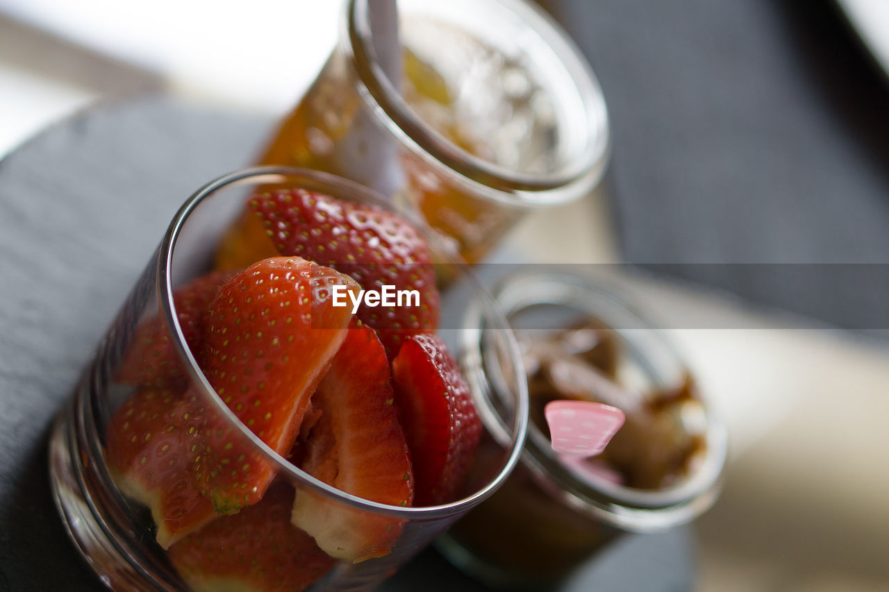 Close-up of strawberries in glass on table