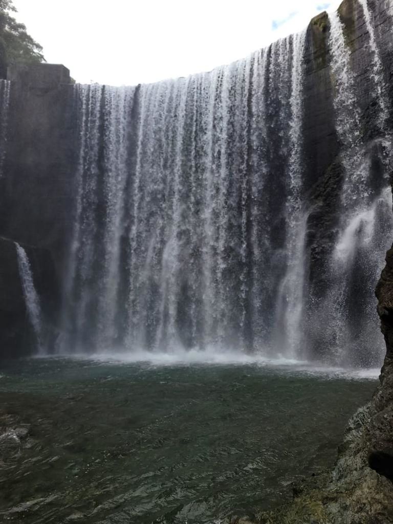 waterfall, water, scenics - nature, beauty in nature, motion, long exposure, water feature, nature, body of water, environment, rock, flowing water, land, travel destinations, no people, plant, splashing, blurred motion, power in nature, tree, flowing, outdoors, cliff, travel, non-urban scene, tourism, rock formation, day, sky, forest, landscape