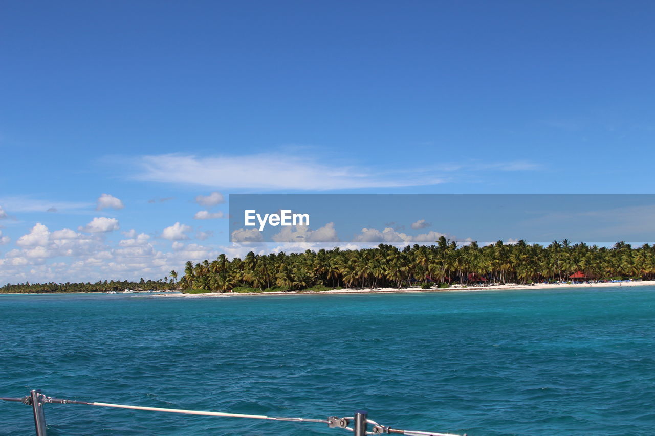 Scenic view of sea against blue sky