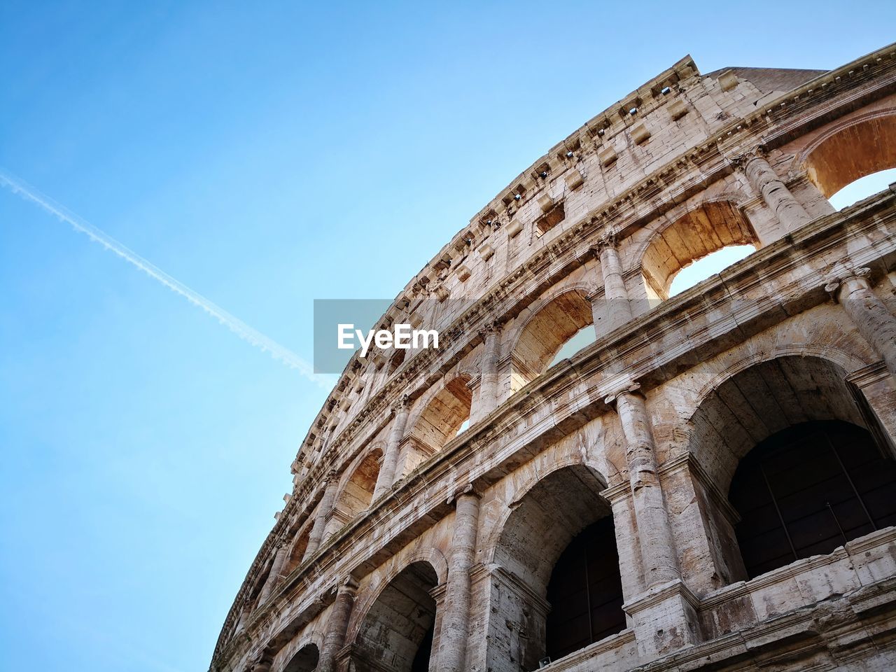 Low angle view of historical building against blue sky