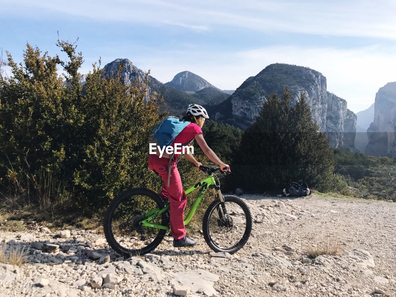 MAN RIDING BICYCLE ON MOUNTAIN