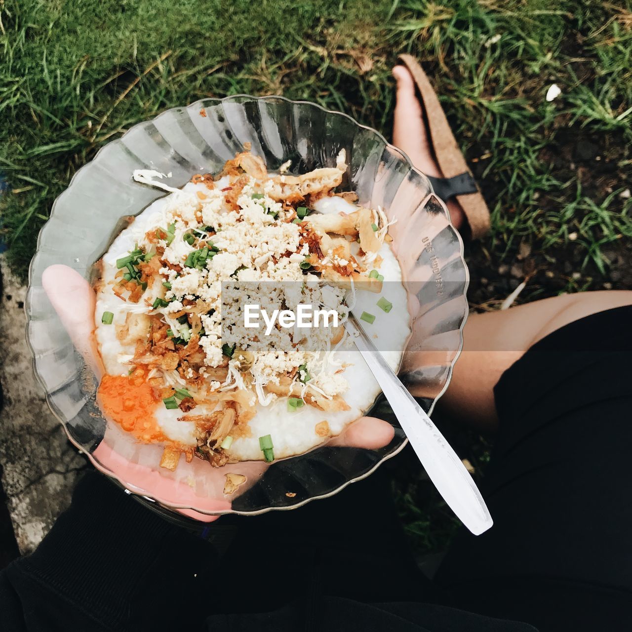 High angle view of woman holding fresh porridge