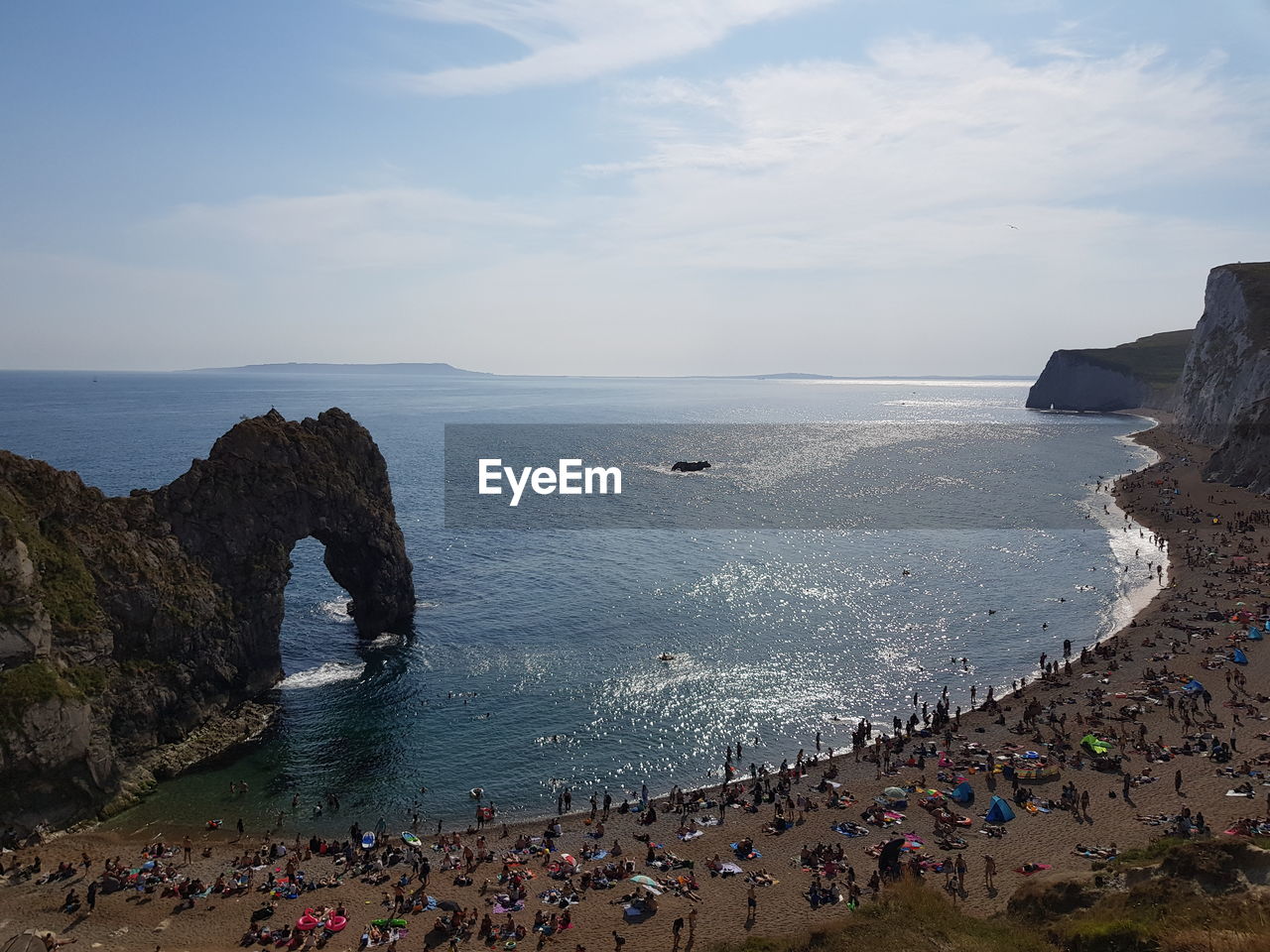 High angle view of people at beach against sky