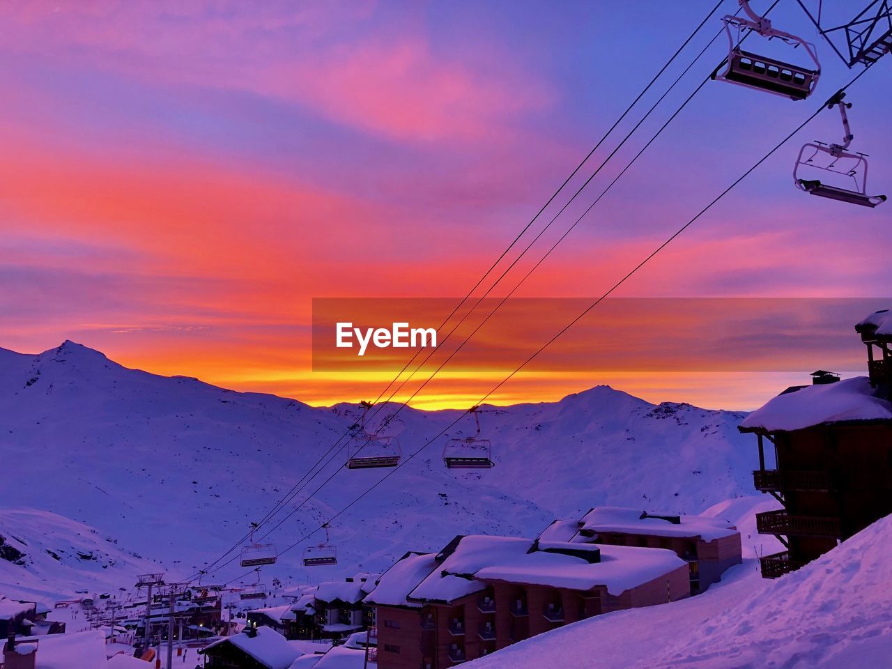 Scenic view of snowcapped mountains against sky during sunset