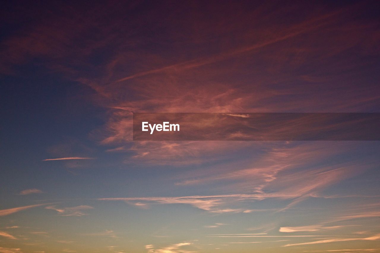 Low angle view of cloudy sky during sunset