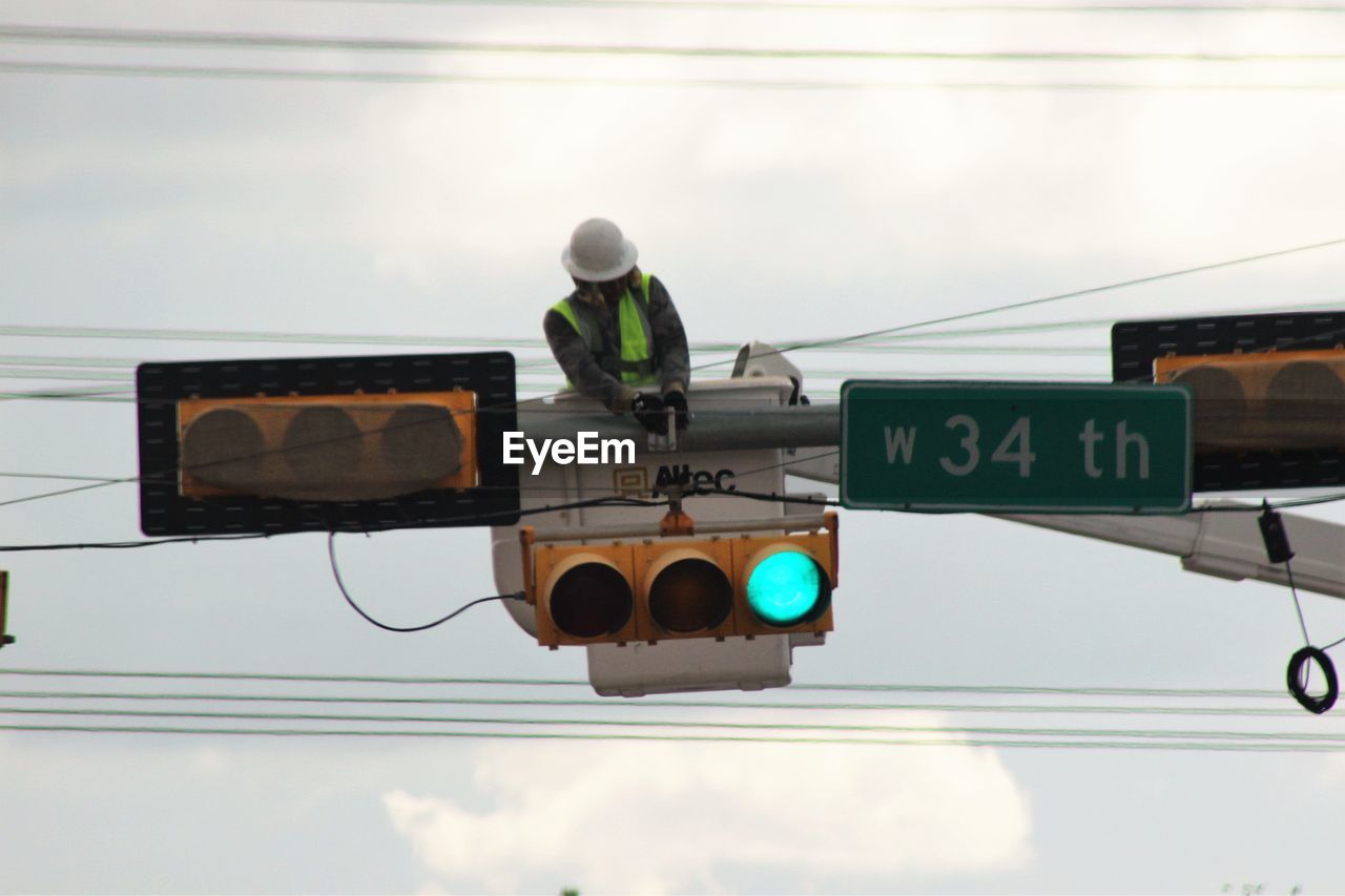 LOW ANGLE VIEW OF ROAD SIGNS