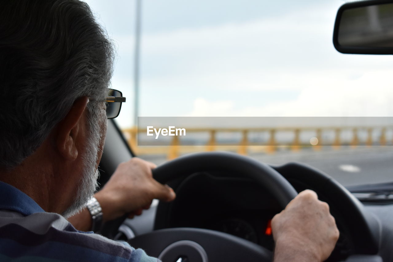 MAN SITTING IN CAR