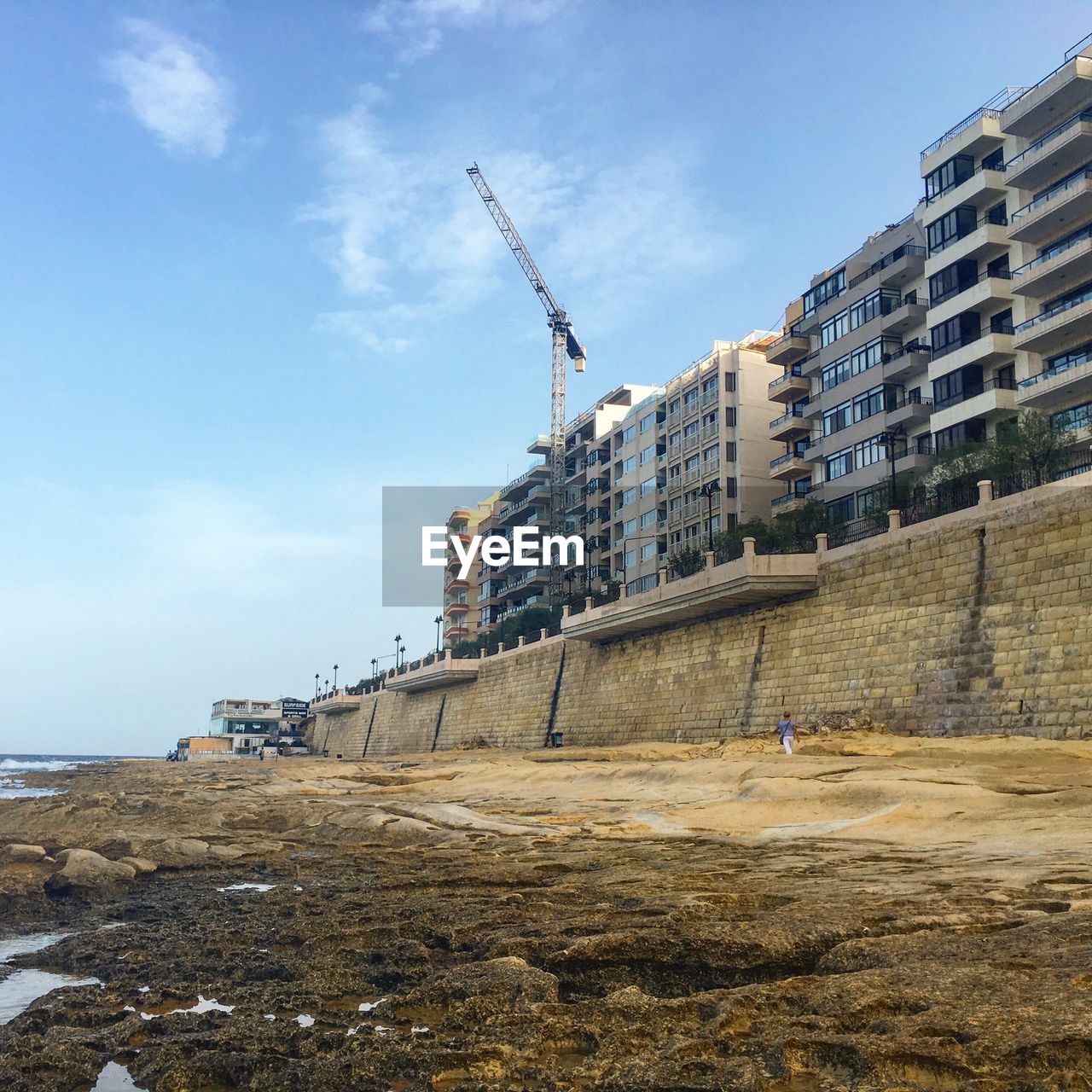 Buildings against sky and beach