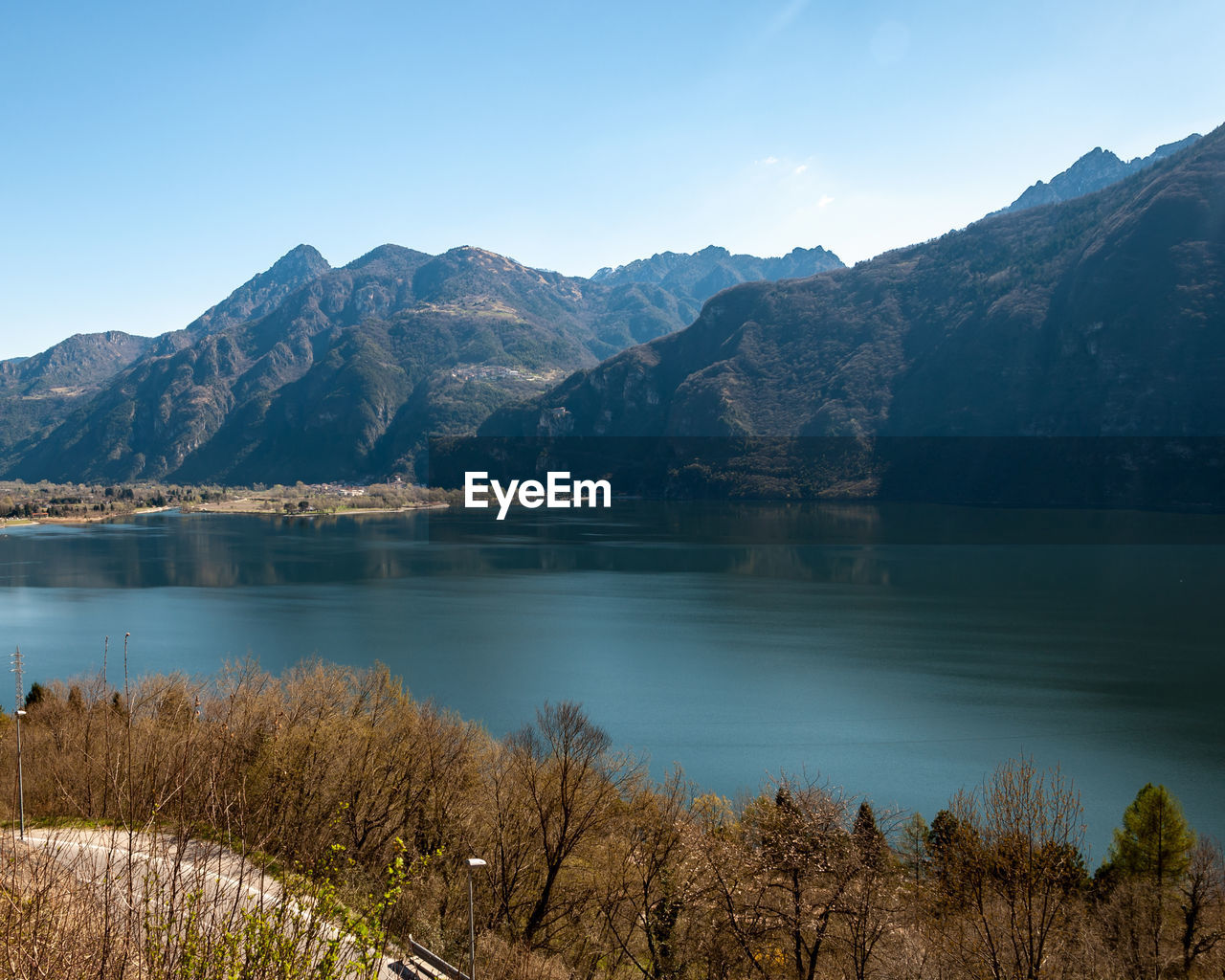 SCENIC VIEW OF LAKE AGAINST MOUNTAIN RANGE