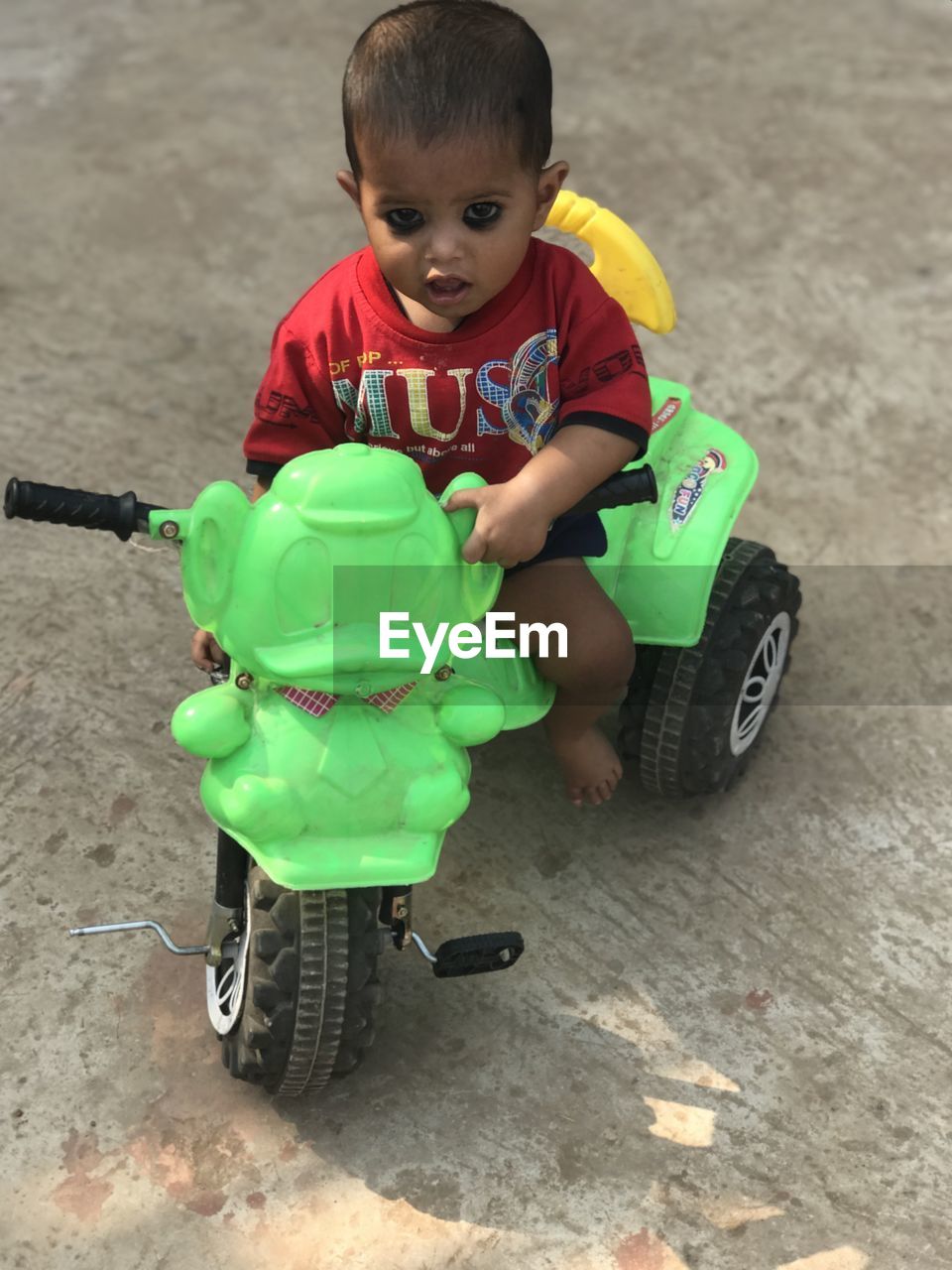 childhood, child, toddler, men, one person, baby, full length, vehicle, transportation, toy, cute, person, portrait, tricycle, emotion, happiness, toy car, land vehicle, mode of transportation, looking at camera, wheel, lifestyles, high angle view, bicycle, smiling, innocence, outdoors, fun, tire, casual clothing