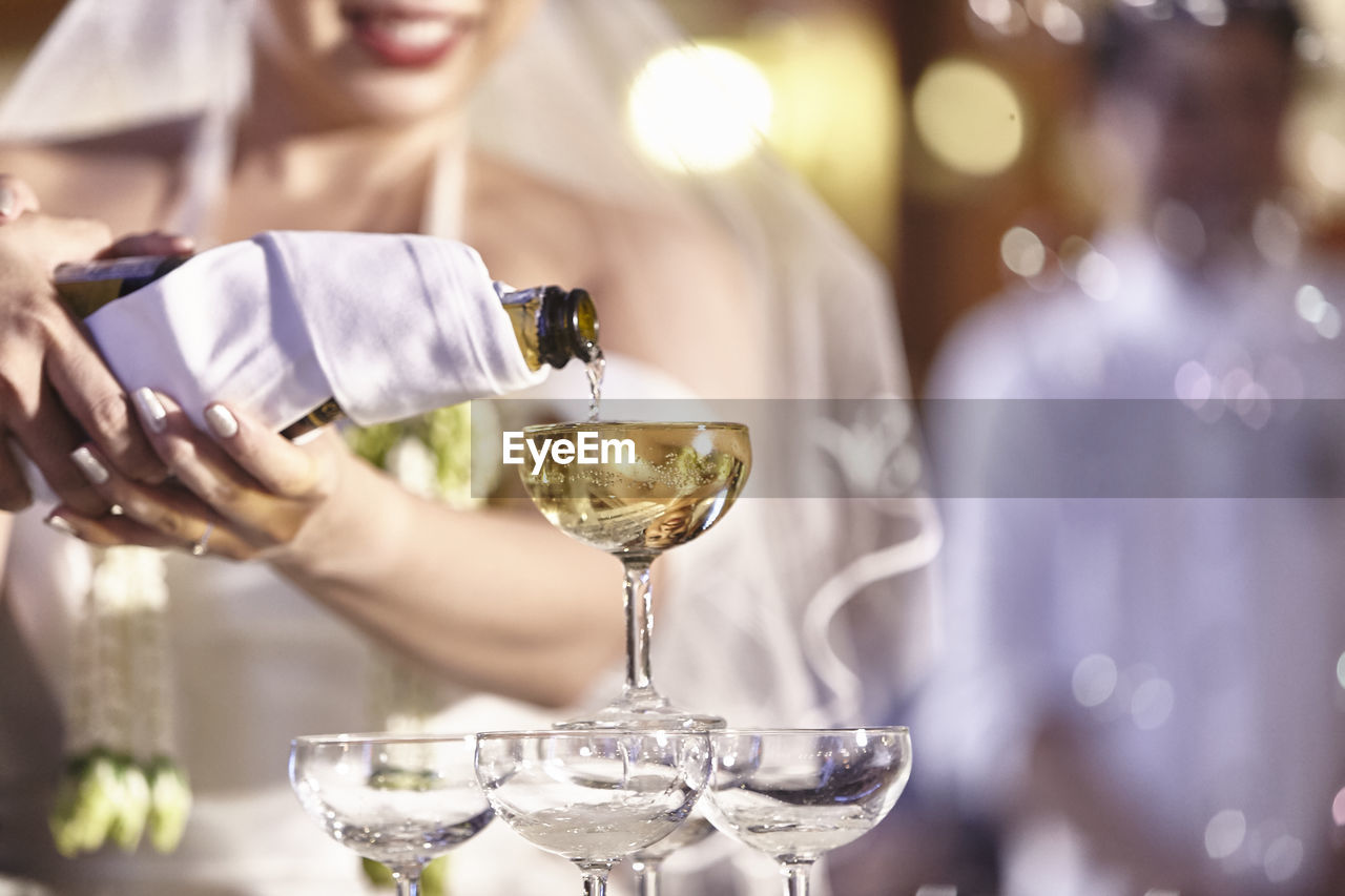 Close-up of woman drinking glasses