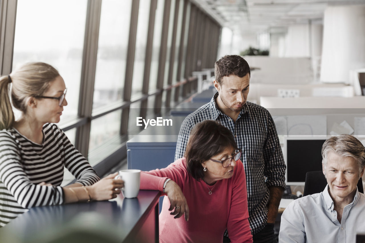 Multi-ethnic business people working in office