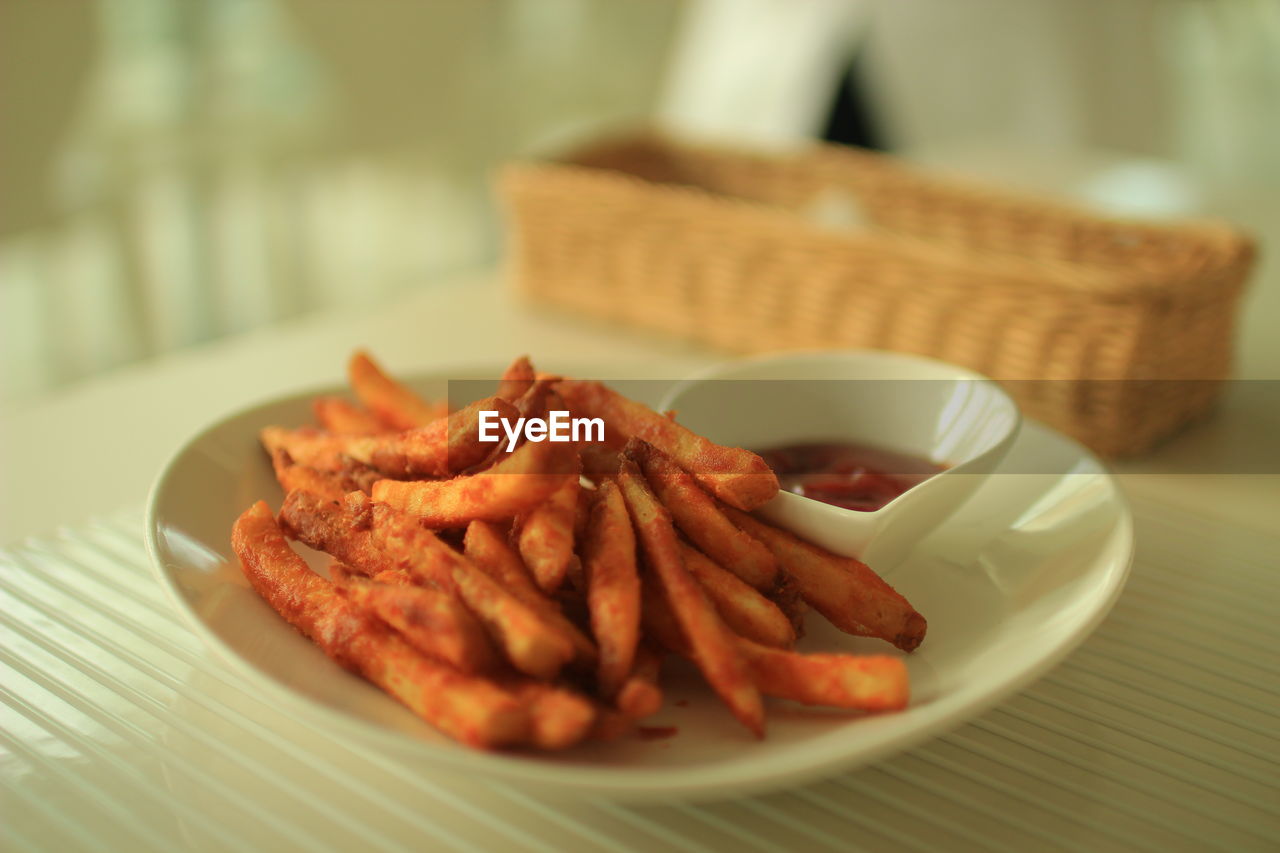 Close-up of french fries with tomato ketchup