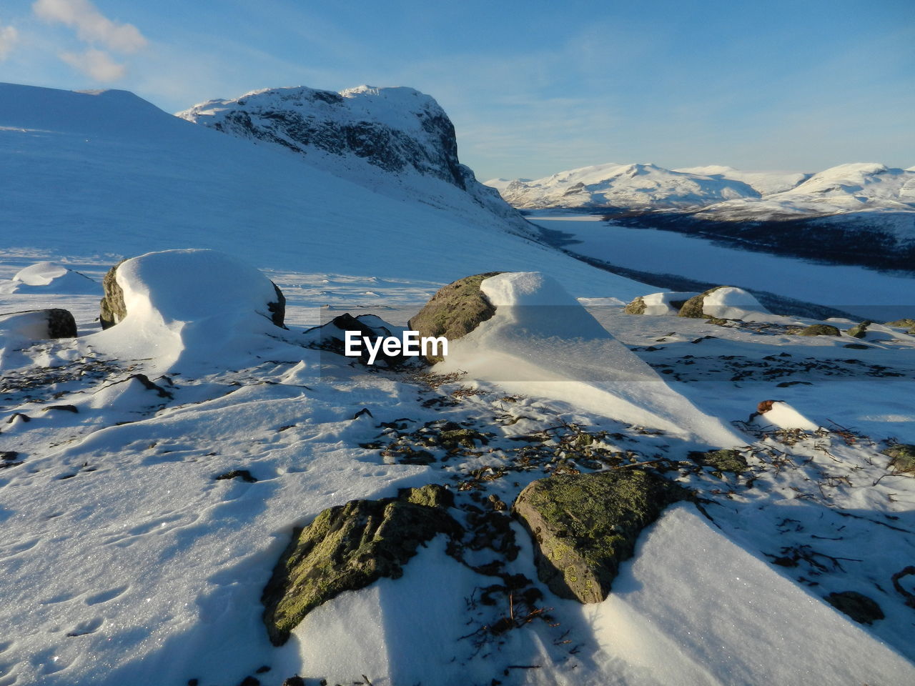 Scenic view of snow covered mountains