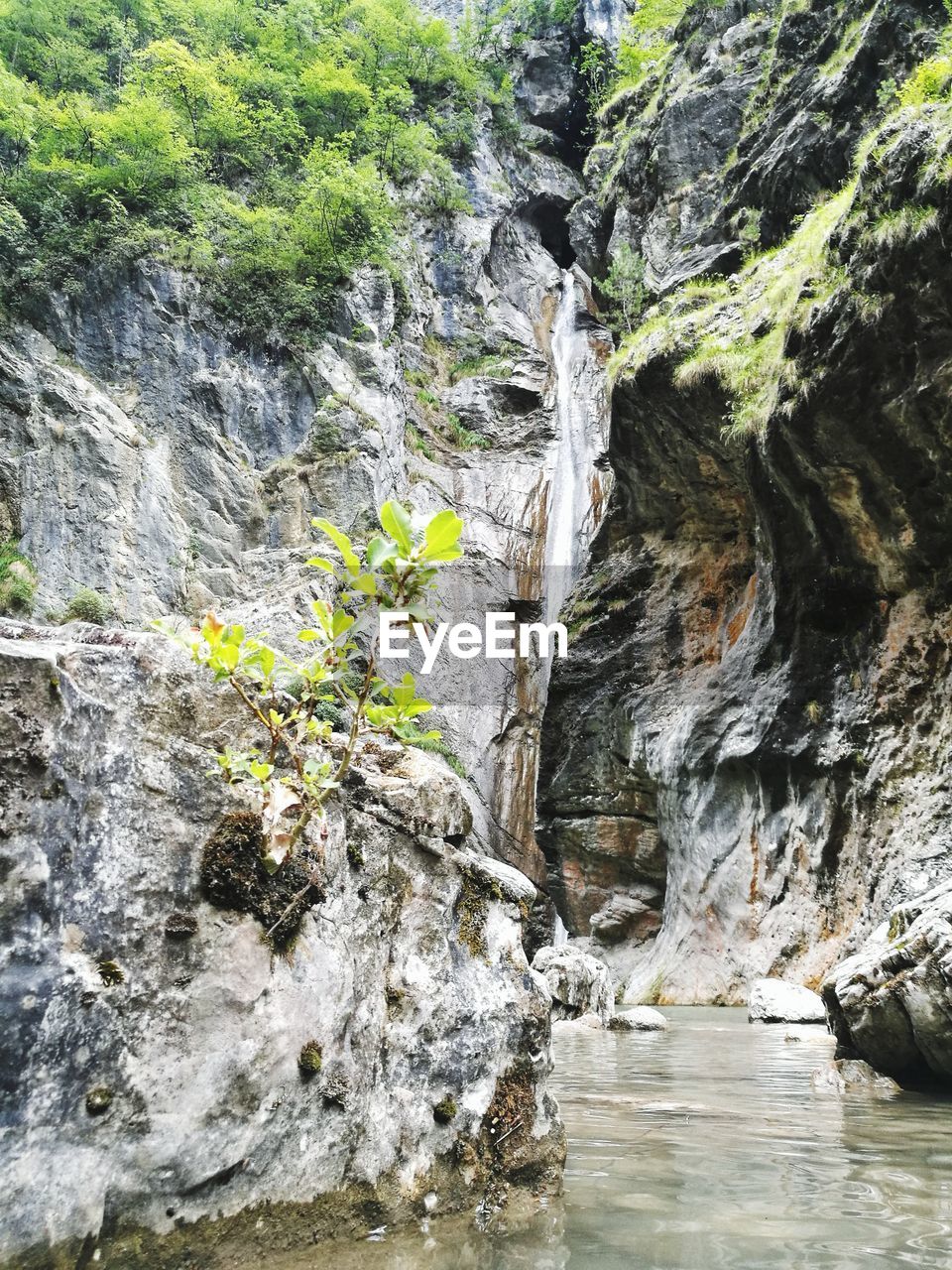 WATER FLOWING THROUGH ROCKS