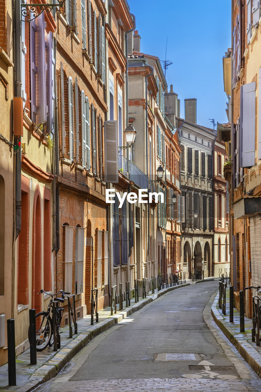 Narrow street in toulouse historical center, france