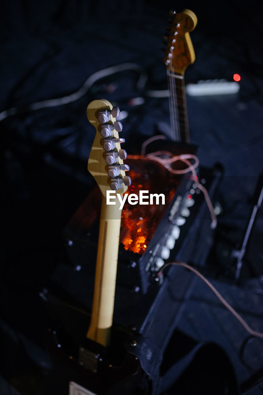 Back view of electric guitar on stage.