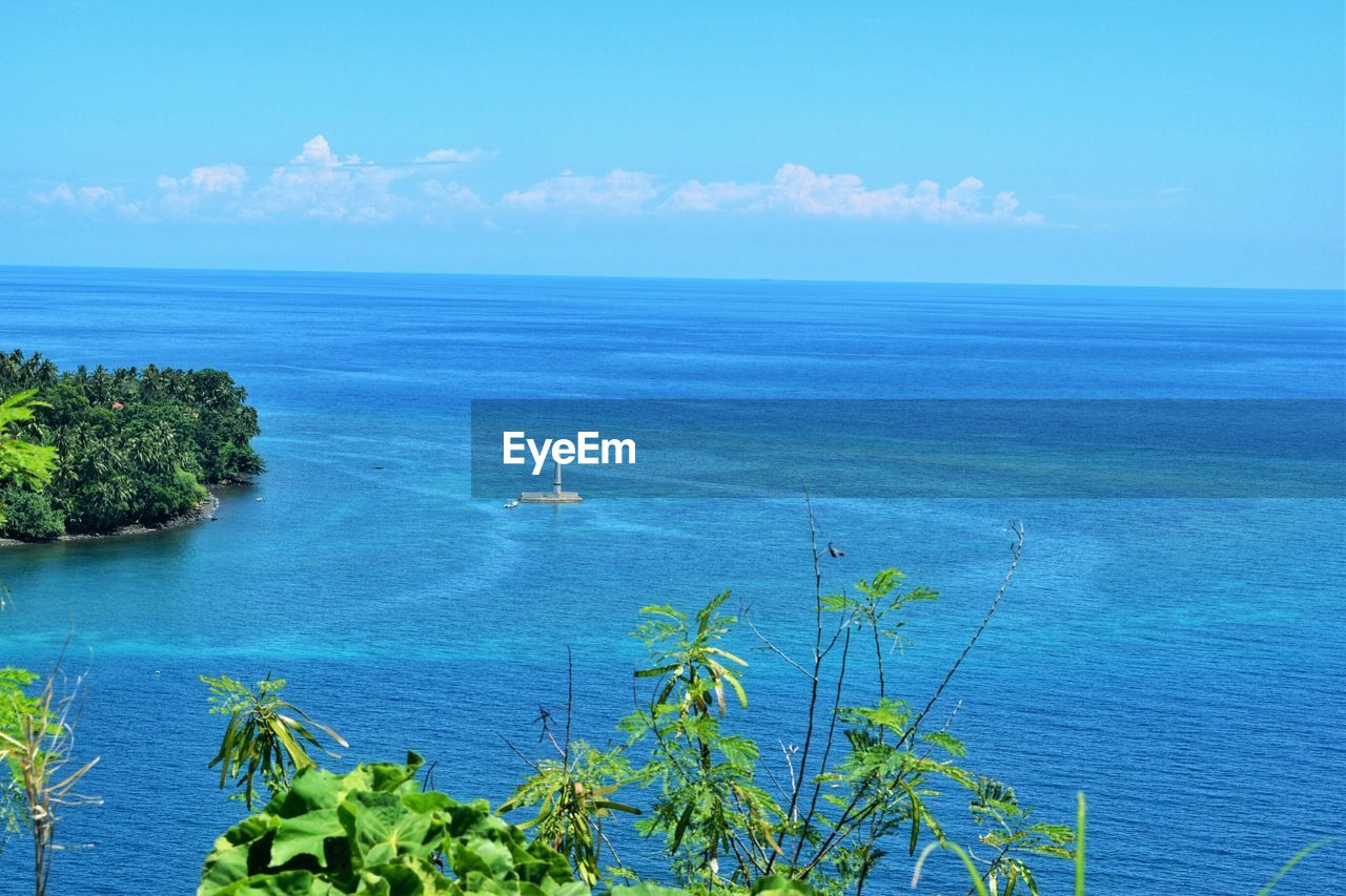 Distant view of sunken cemetery amidst sea