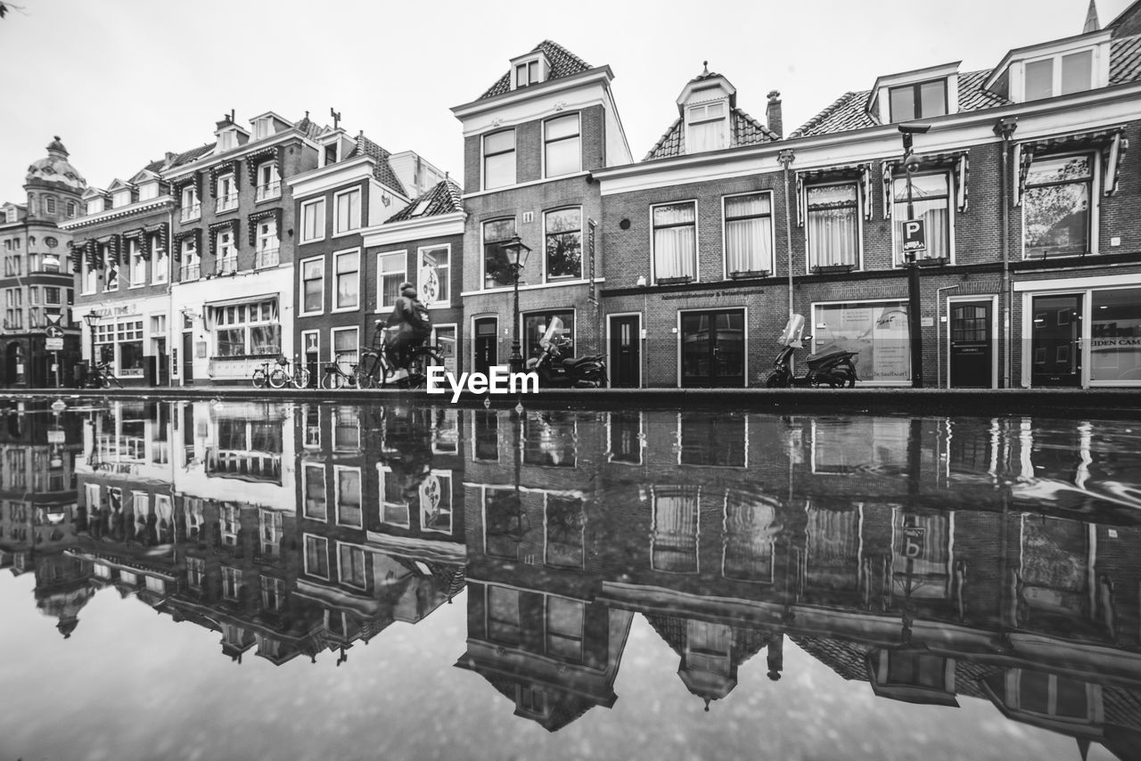 REFLECTION OF BUILDINGS IN WATER