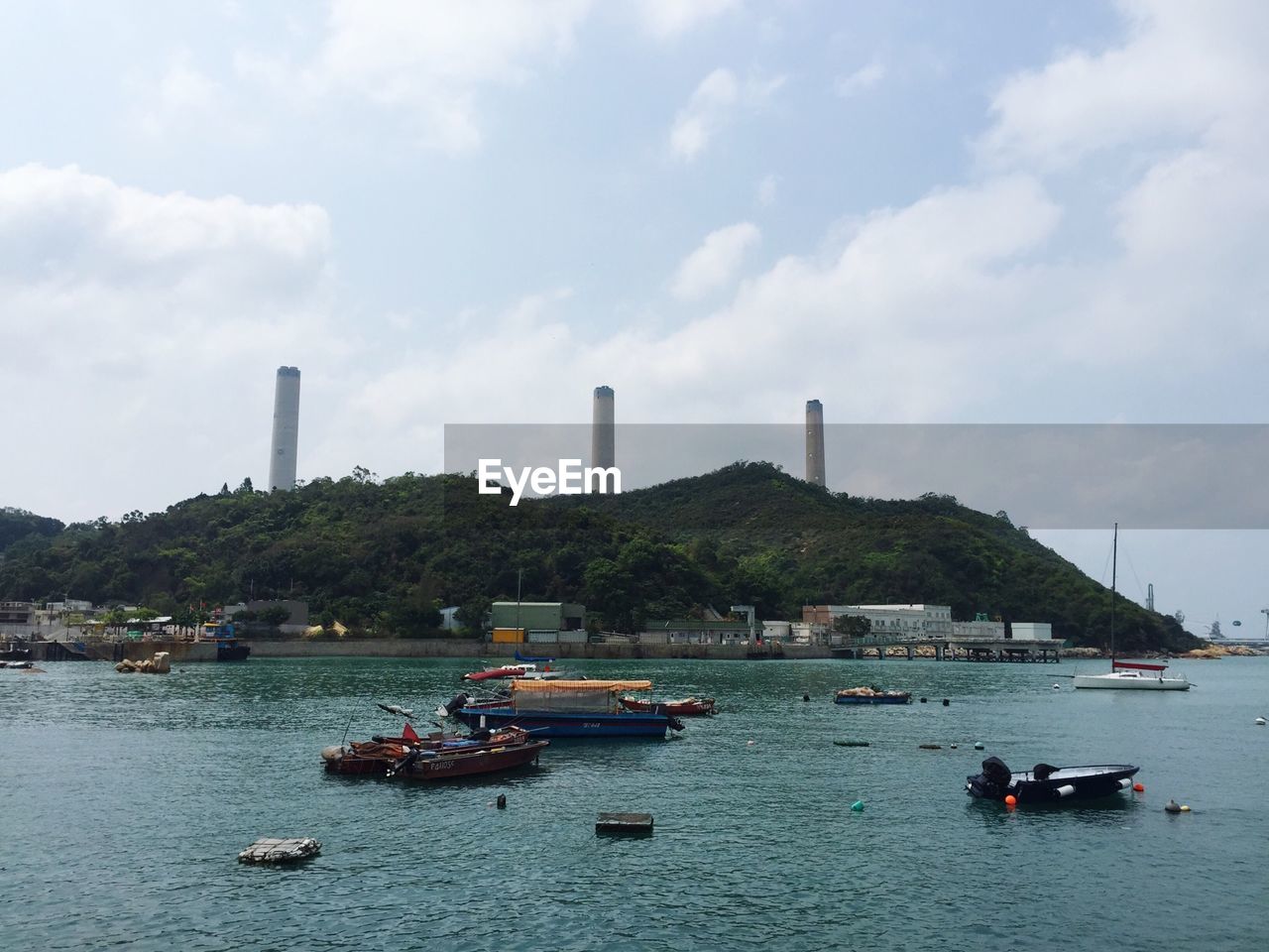 Boats moored on bay at yung shue wan