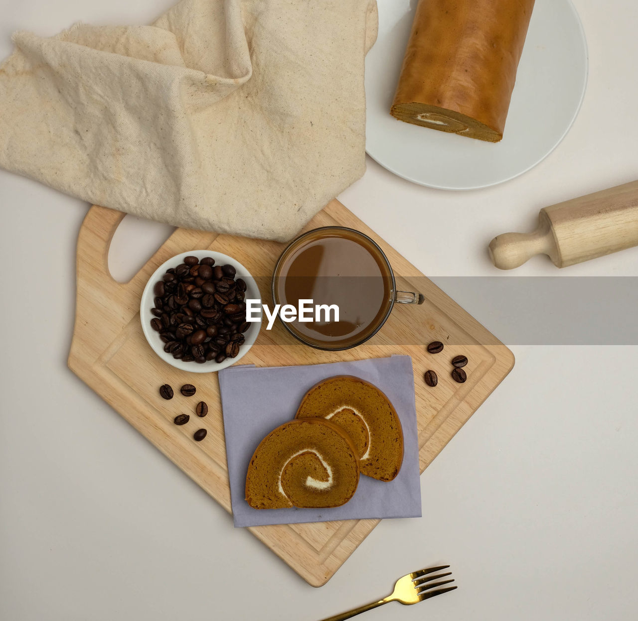 High angle view of coffee cup and cake on table