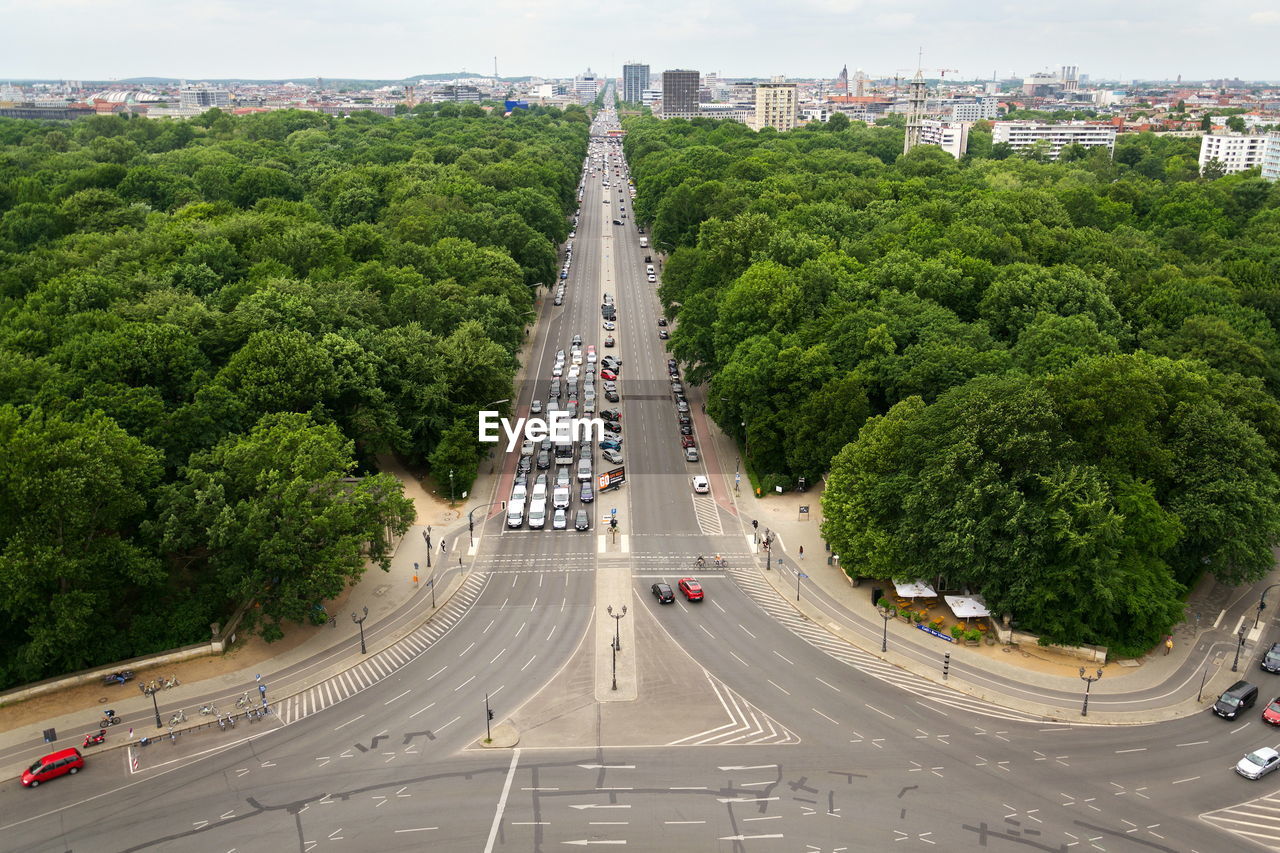 High angle view of road amidst trees in city