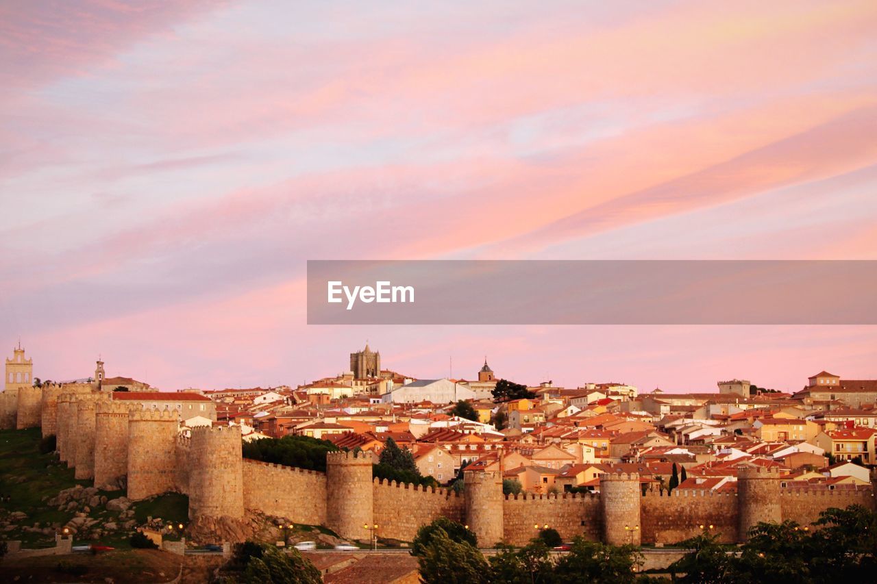 Fortified wall at avila against sky