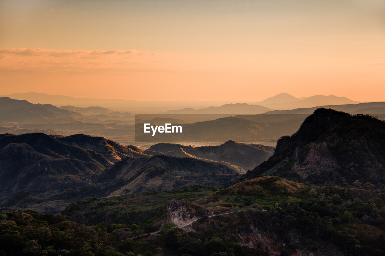 Scenic view of mountains against sky during sunset