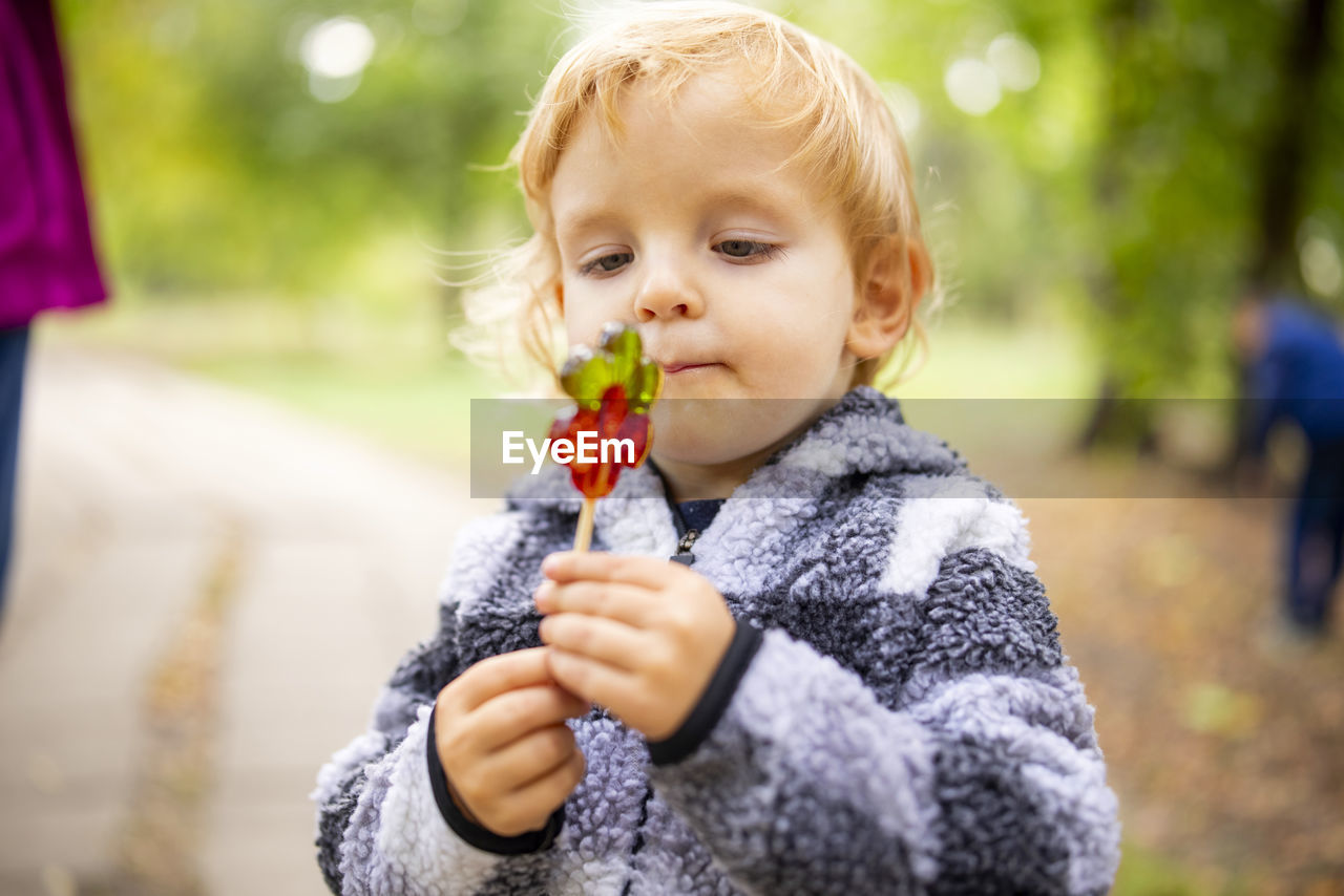 portrait of cute girl holding flower