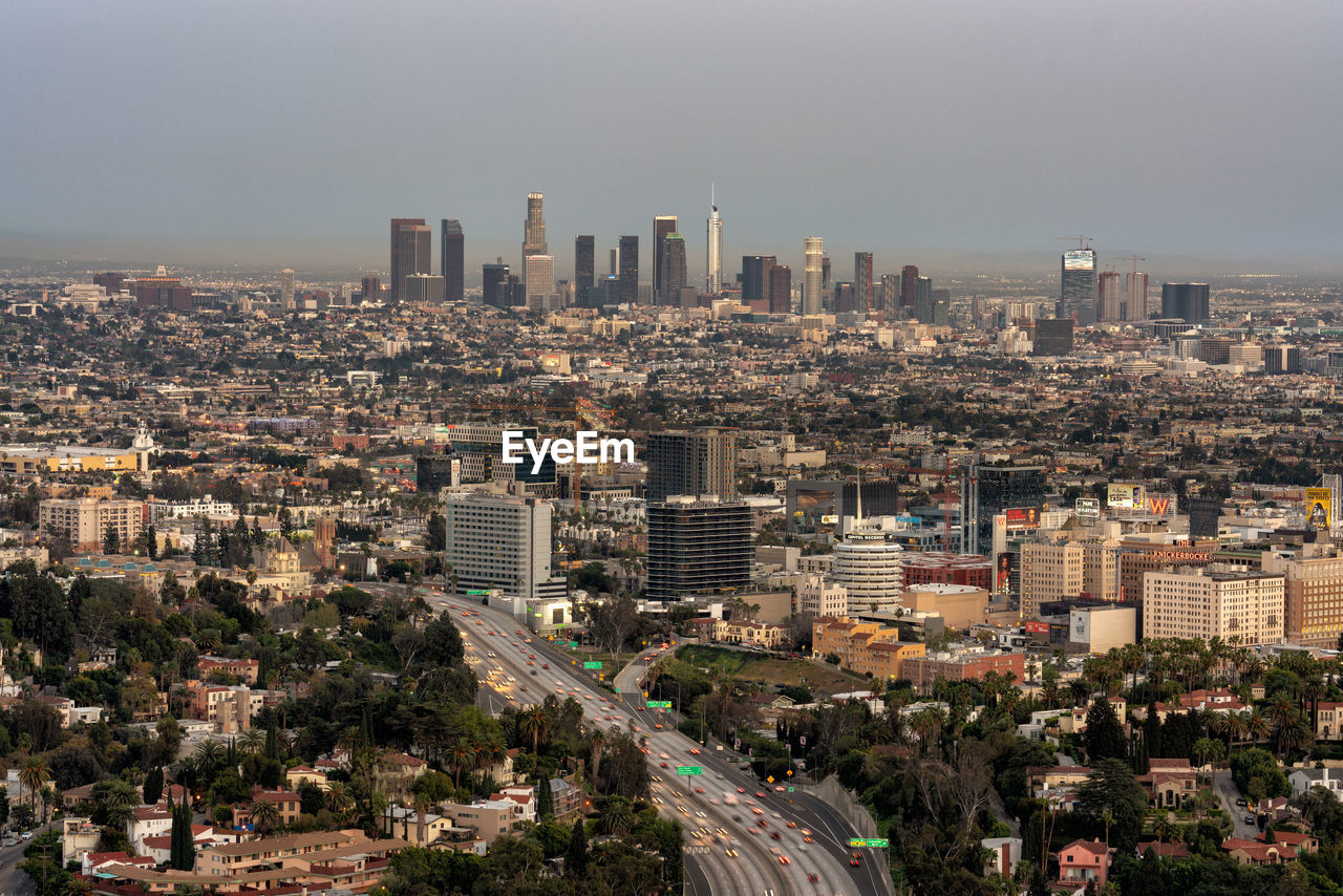 High angle view of modern buildings in city against sky