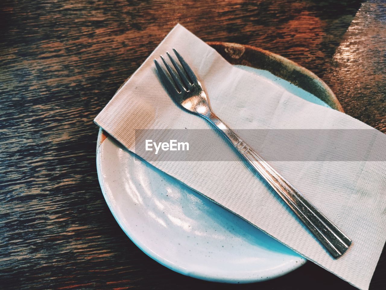 High angle view of tissue paper in plate on table