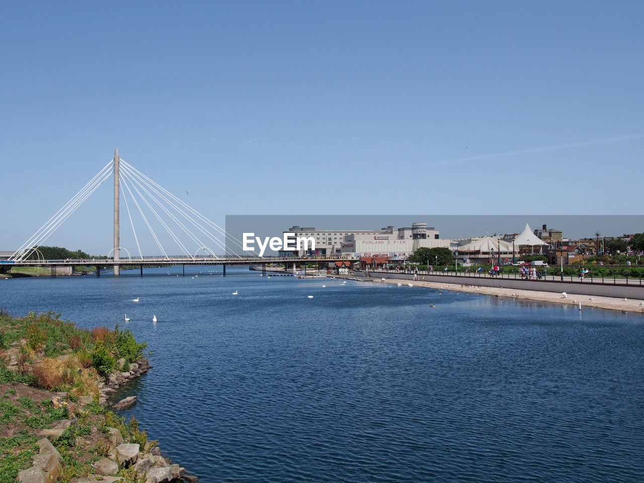 BRIDGE OVER SEA AGAINST CLEAR SKY