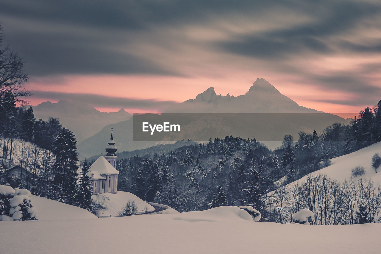 View of snow covered mountain against cloudy sky