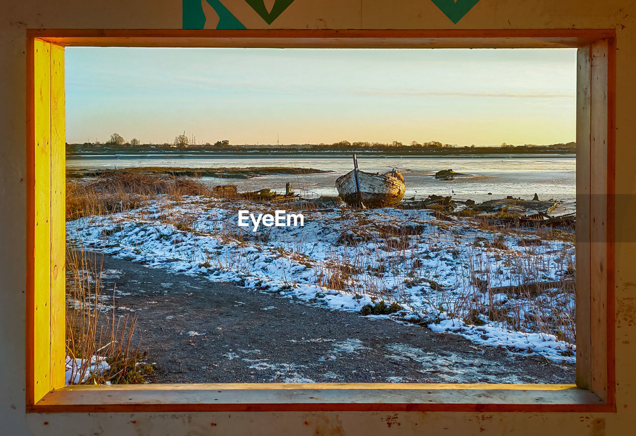 SCENIC VIEW OF SEA DURING WINTER AGAINST SKY