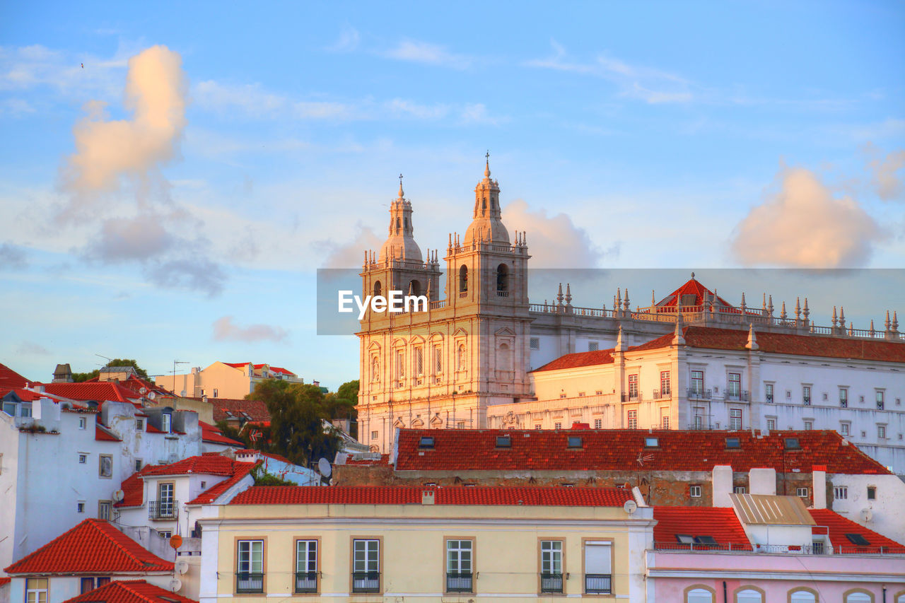 Buildings in city against sky