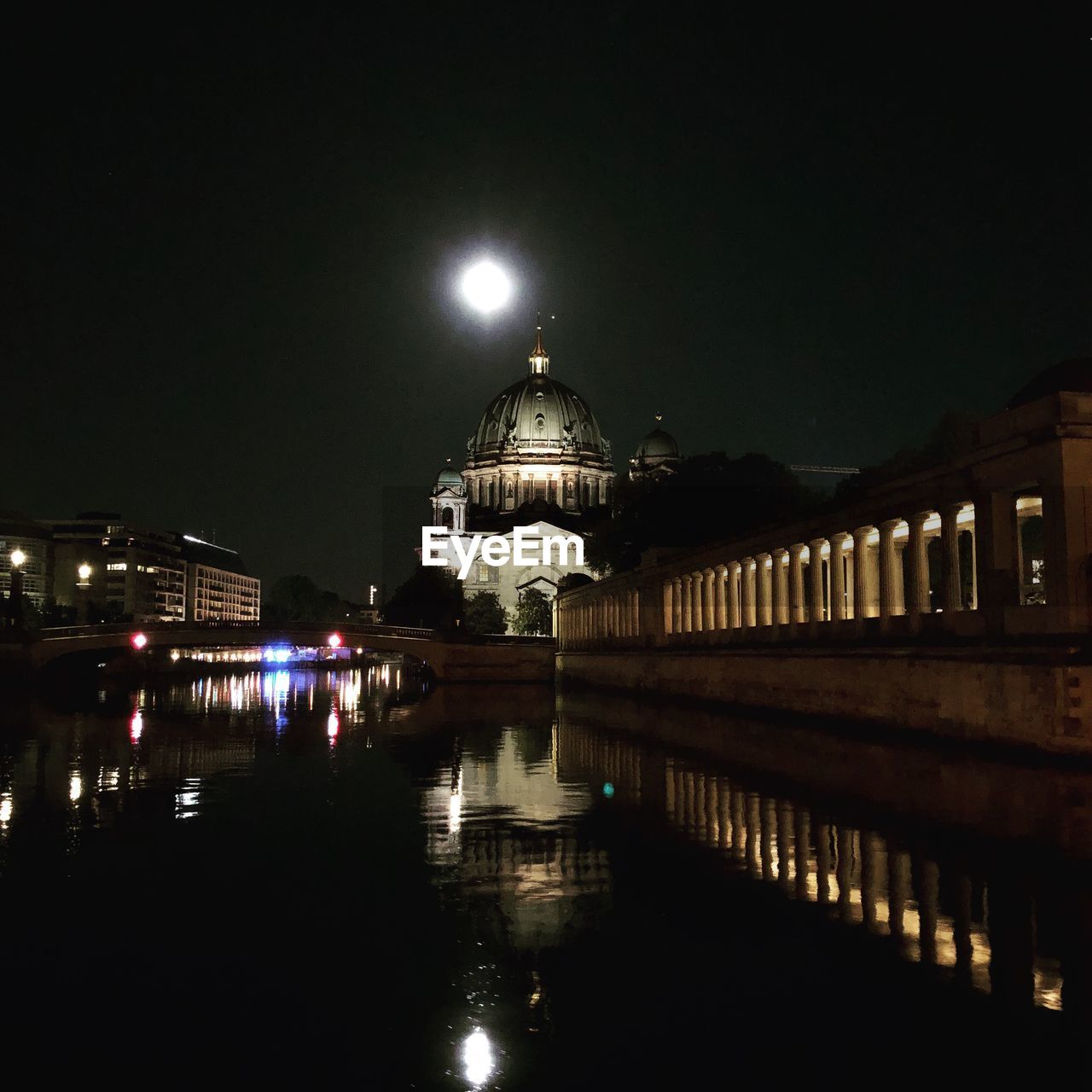 Illuminated building against sky at night