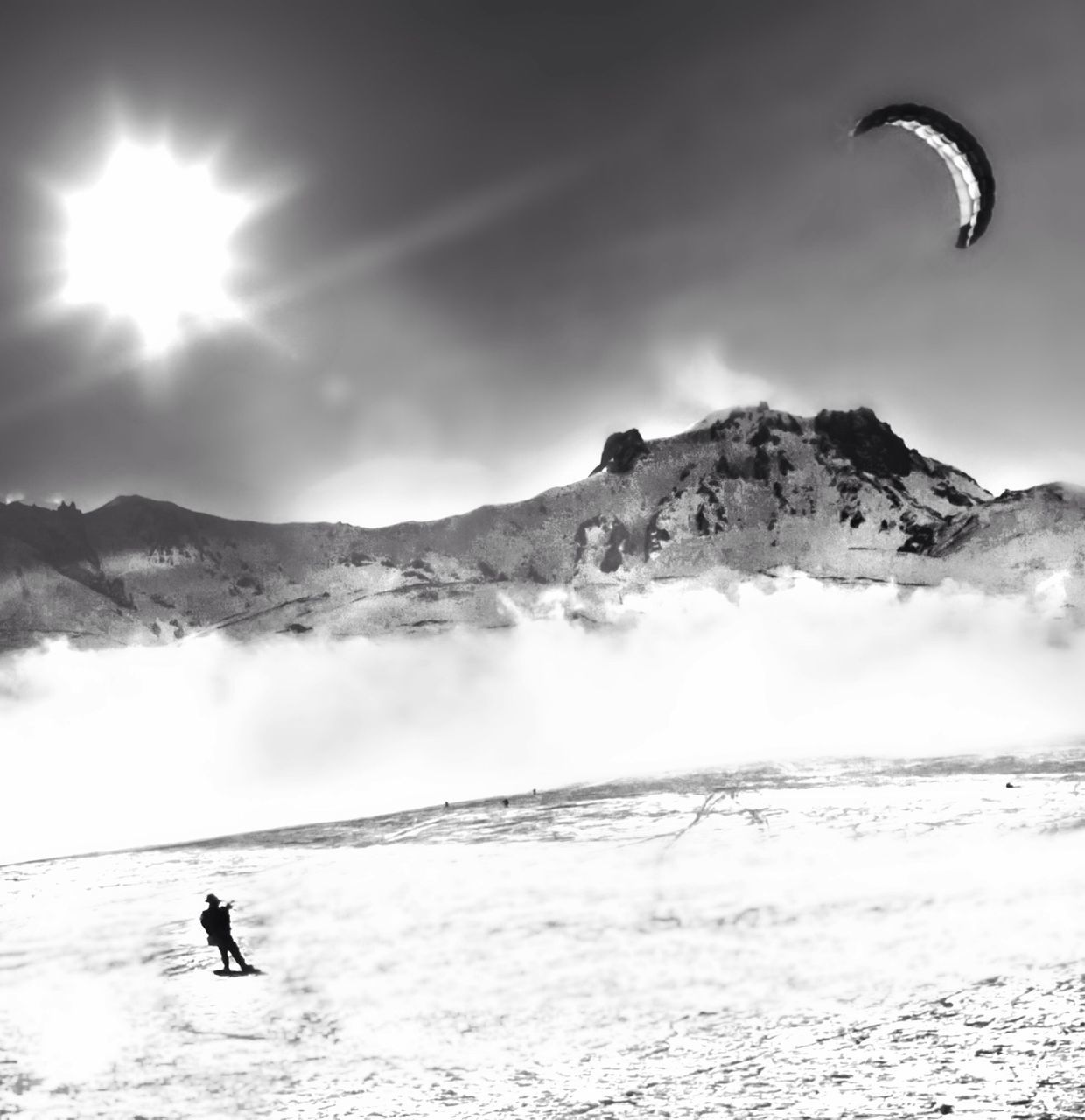 TOURISTS ON SNOW COVERED MOUNTAIN