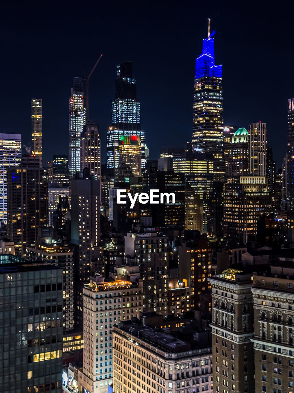 Illuminated buildings in city at night