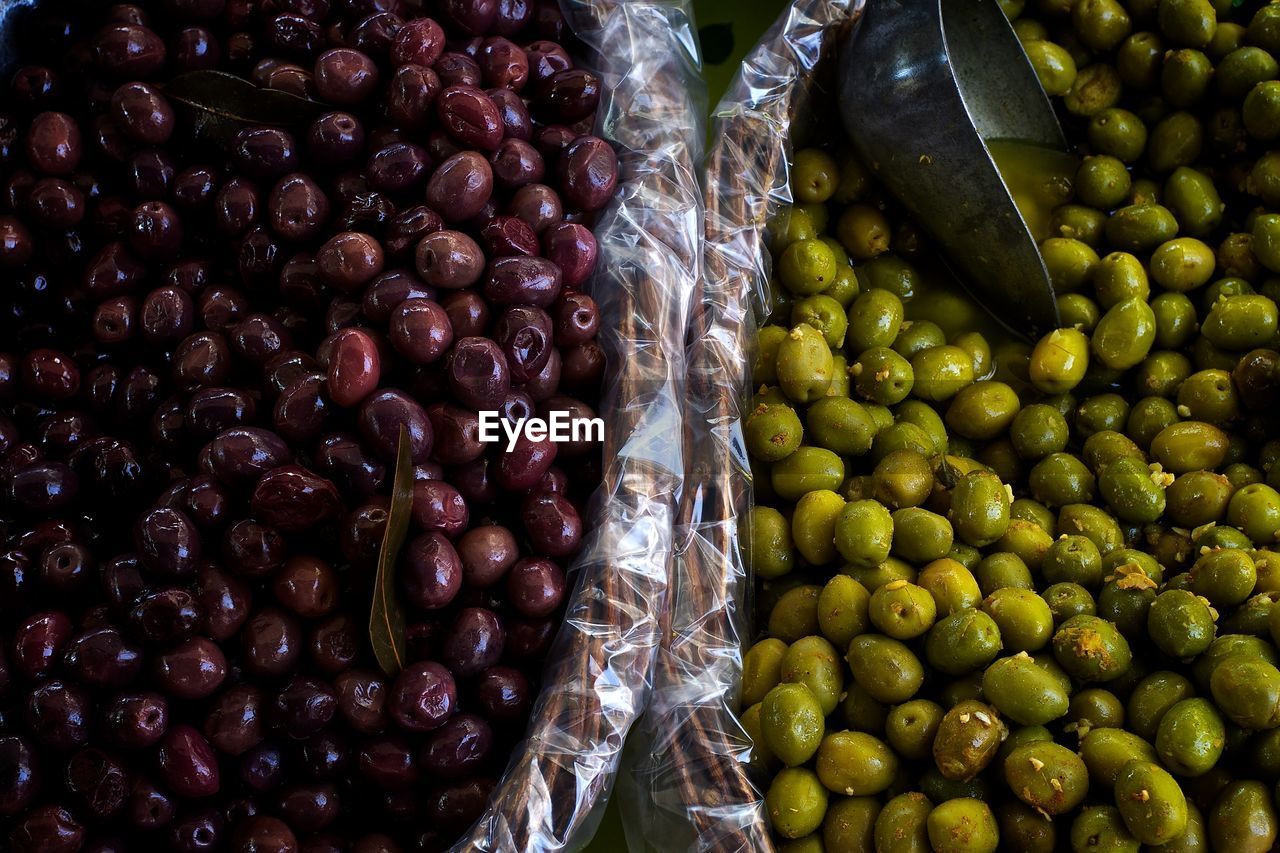 High angle view of preserved olives for sale in market