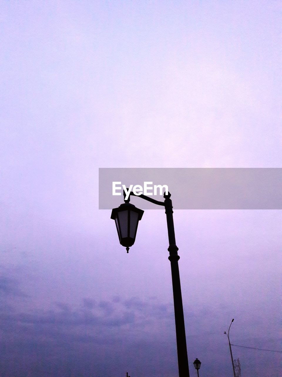 Low angle view of street light against sky