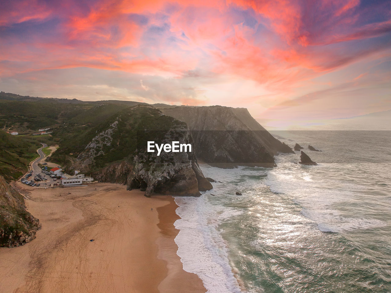 Aerial view of waves on a beautiful sandy ocean beach and cliff. panorama atlantic coastline.